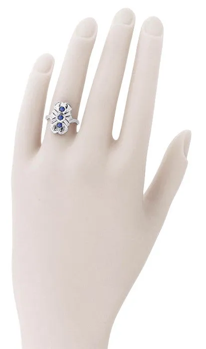 Art Deco Filigree Three Stone Blue Sapphires Cocktail Statement Ring in 14 Karat White Gold